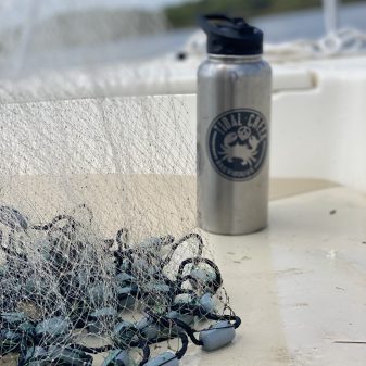 TCB bottle with net out boating